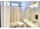 Clean bathroom with a tub shower combo and granite countertop at 12732 Rockrose Gln, Lakewood Ranch, FL 34202