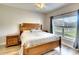 Large bedroom with a king-size bed and plenty of natural light at 12732 Rockrose Gln, Lakewood Ranch, FL 34202