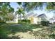 House exterior with lush landscaping and palm trees at 12732 Rockrose Gln, Lakewood Ranch, FL 34202