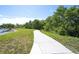 Concrete path alongside a scenic lake at 12732 Rockrose Gln, Lakewood Ranch, FL 34202