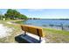 Park bench overlooking a tranquil lake at 12732 Rockrose Gln, Lakewood Ranch, FL 34202