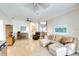 Living room with sectional sofa and view into kitchen at 12732 Rockrose Gln, Lakewood Ranch, FL 34202