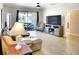 Living area featuring a large TV and comfortable seating at 12732 Rockrose Gln, Lakewood Ranch, FL 34202