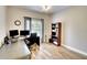 Home office with wood flooring and built-in shelving at 12732 Rockrose Gln, Lakewood Ranch, FL 34202