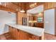 View of kitchen with granite countertops, stainless steel appliances, and wood cabinets at 12845 N Branch Rd, Sarasota, FL 34240