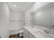 Bathroom with a shower/tub combo, double vanity, and white tile at 13009 Cedar Elm Lane, Parrish, FL 34219