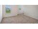 Spacious bedroom with neutral carpeting and large window at 13009 Cedar Elm Lane, Parrish, FL 34219