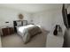 Spacious bedroom with a large bed, nightstands, and a modern mirror at 13017 Cedar Elm Lane, Parrish, FL 34219