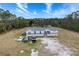 Aerial view of a manufactured home with a large yard at 14150 Manatee Rd, Parrish, FL 34219
