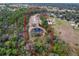 Aerial view of property highlighting home and pond at 14150 Manatee Rd, Parrish, FL 34219