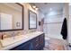 Bathroom boasts double sinks, a shower/tub combo, and stylish tile at 14150 Manatee Rd, Parrish, FL 34219