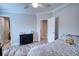 Spacious bedroom with a bed, dresser, and access to hallway at 14150 Manatee Rd, Parrish, FL 34219