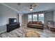 Bright Bedroom featuring a crib and comfortable seating at 14150 Manatee Rd, Parrish, FL 34219