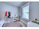 Charming bedroom with clothes rack, window and storage at 14150 Manatee Rd, Parrish, FL 34219