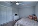 Charming bedroom featuring a bed, dresser, and plenty of natural light at 14150 Manatee Rd, Parrish, FL 34219