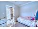 Cozy bedroom with a daybed and an open doorway to the kitchen at 14150 Manatee Rd, Parrish, FL 34219