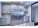 Stainless steel refrigerator in a kitchen with gray cabinets at 14150 Manatee Rd, Parrish, FL 34219
