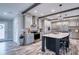 Modern kitchen with island and stainless steel appliances at 14150 Manatee Rd, Parrish, FL 34219