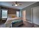 Main bedroom with floral accent wall and king-size bed at 14150 Manatee Rd, Parrish, FL 34219