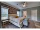 Main bedroom with floral accent wall and king-size bed at 14150 Manatee Rd, Parrish, FL 34219