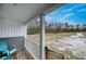Front porch with teal chairs and view of yard at 14150 Manatee Rd, Parrish, FL 34219
