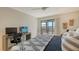 King bedroom with private balcony, work space, and coastal decor at 1510 Pelican Point Dr # Ba168, Sarasota, FL 34231