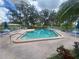 Refreshing community pool with ample lounge chairs and patio tables at 1553 Stewart Dr # 513, Sarasota, FL 34232