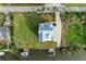 Aerial view of a waterfront home with private docks and boat slips at 1825 Bayshore Dr, Terra Ceia, FL 34250