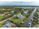 Elevated view of the house and surrounding neighborhood at 1825 Bayshore Dr, Terra Ceia, FL 34250