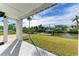 Waterfront backyard with private dock and lush landscaping at 1825 Bayshore Dr, Terra Ceia, FL 34250