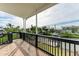 Covered balcony with waterfront views, offering a serene outdoor retreat at 1825 Bayshore Dr, Terra Ceia, FL 34250