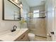 Modern bathroom with a walk-in shower and updated vanity at 1825 Bayshore Dr, Terra Ceia, FL 34250