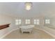 Bathroom featuring a classic clawfoot tub and chandelier at 1825 Bayshore Dr, Terra Ceia, FL 34250