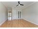 Spacious bedroom with hardwood floors and French doors at 1825 Bayshore Dr, Terra Ceia, FL 34250
