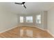 Bright bedroom with hardwood floors and bay windows at 1825 Bayshore Dr, Terra Ceia, FL 34250
