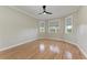 Bright bedroom featuring hardwood floors and a cozy bay window area at 1825 Bayshore Dr, Terra Ceia, FL 34250