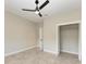 Well-lit bedroom with tile floors and a spacious closet at 1825 Bayshore Dr, Terra Ceia, FL 34250