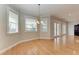 Charming dining room featuring hardwood floors, natural light, and crown molding at 1825 Bayshore Dr, Terra Ceia, FL 34250