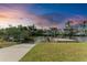 Waterfront view of boat dock and canal surrounded by lush landscaping at 1825 Bayshore Dr, Terra Ceia, FL 34250