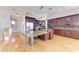 Large kitchen features an island, stainless steel appliances and dark wood cabinetry at 1825 Bayshore Dr, Terra Ceia, FL 34250