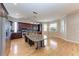 Open concept kitchen featuring an island with seating and stainless steel appliances at 1825 Bayshore Dr, Terra Ceia, FL 34250