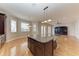 Stunning kitchen island with granite countertop and hardwood floors at 1825 Bayshore Dr, Terra Ceia, FL 34250