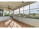 Relaxing screened lanai offers beautiful views and a ceiling fan at 1825 Bayshore Dr, Terra Ceia, FL 34250