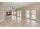 Spacious living area with tile floors and double doors leading outdoors at 1825 Bayshore Dr, Terra Ceia, FL 34250