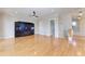 Spacious living room with hardwood floors and a custom entertainment center at 1825 Bayshore Dr, Terra Ceia, FL 34250