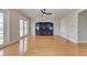 Hardwood floors and dark wood entertainment center in this naturally lit living space at 1825 Bayshore Dr, Terra Ceia, FL 34250