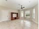 Spacious living room with tile floors and bay windows at 1825 Bayshore Dr, Terra Ceia, FL 34250