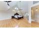 Large main bedroom with high ceilings and hardwood floors at 1825 Bayshore Dr, Terra Ceia, FL 34250