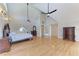 Expansive main bedroom featuring vaulted ceiling and hardwood floors at 1825 Bayshore Dr, Terra Ceia, FL 34250