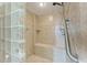 Walk-in shower with glass block and built-in seat at 1825 Bayshore Dr, Terra Ceia, FL 34250